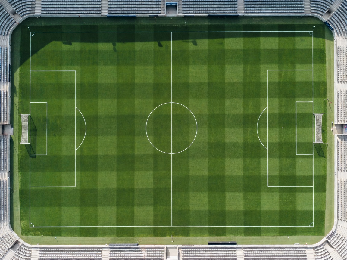 Overhead view of a pristine football pitch ready for a major tournament match